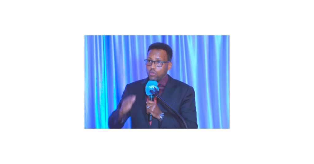 Abdi Adan Hossow receiving a community award at the Somali Independence Day celebration in Oregon.